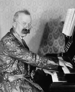 older man playing piano